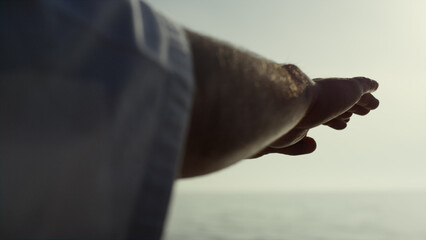 Fototapeta premium Sportsman hands waving training judo on seacoast close up. Athlete exercising.