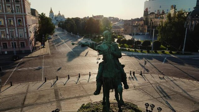 KYIV, UKRAINE - SEPTEMBER 2021. Monument to Bogdan Khmelnitsky in the morning at dawn. Aerial view. Drone flies around the monument.