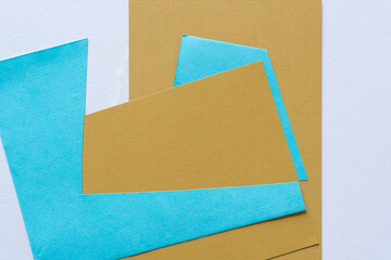 background with paper in blue and dark ochre yellow