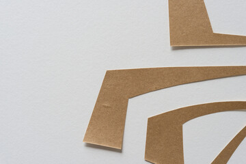 four paper shapes on blank paper