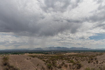 Fototapeta premium Scenic aerial Las Cruces vista under dramatic monsoonal sky, New Mexico 