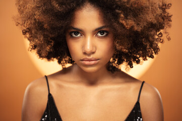 Portrait of young beautiful african woman with afro hair