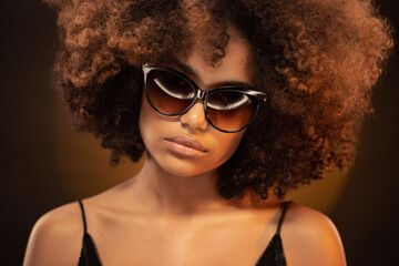 Beauty portrait of beautiful african woman wearing sunglasses