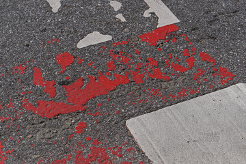 Faded red paint crossing