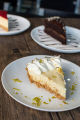 Cheesecake and other desserts on wooden table