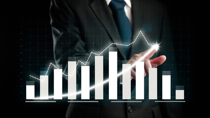 Businessman draw finance allusive graph chart showing business profit growth increasing to future target . Excellent financial status of corporate business rise up . Finance and money technology .