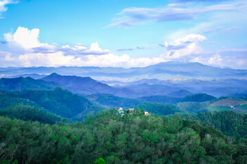Landscape of misty mountains of Mt.Gunung Silipat Betong,Yala,Thailand. View of coniferous forest, layers of mountain and haze in the hills at distance. Tourism and traveling concept.