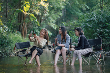 group of Asian girls enjoying a day at the  during holiday camping
