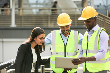 Architects and worker at the construction site.