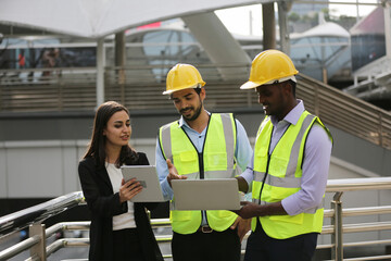 Architects and worker at the construction site.