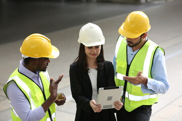 Architects and worker at the construction site.