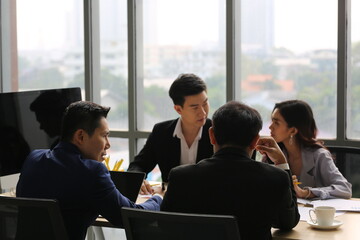 Businessman Giving Speech On Business Meeting With Colleagues, Discussing Work Ideas And Projects, Making Presentation Standing In Modern Office. Teamwork, Entrepreneurship, Corporate Meeting