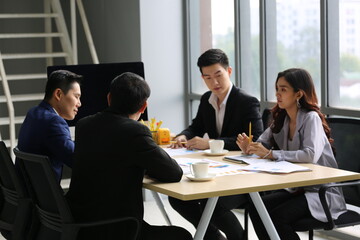 Young Asian business team people meeting in office