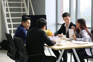 Young Asian business team people meeting in office