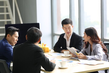 Young Asian business team people meeting in office
