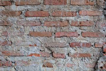 red brick wall texture unfinished close up