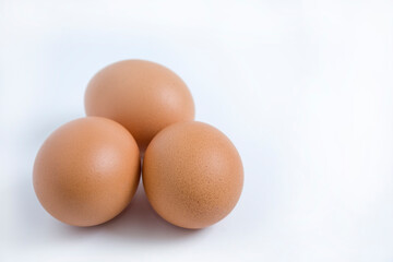 Three eggs isolated from the white background.