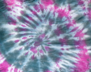 Colorful gray-red tie dye pattern on the fabric. Flat lay.