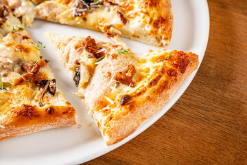 pizza with mushroom on the white plate