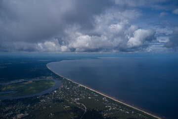 Cumulus storm clouds in blue sky. Beautiful spring landscape with cloudy skyline, aerial view from...