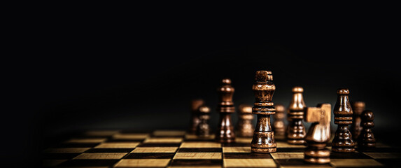 King chess stand on chessboard concepts of competition challenge of leader business team or teamwork volunteer or wining and leadership strategic plan and risk management or team player.