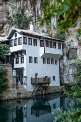 Fototapeta na wymiar Dervish House or Blagaj Tekija. The building is a Dervish monastery outside Mostar city and nearly 600 years old - Blagaj, Mostar - Bosnia and Herzegovina