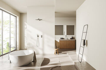 Fototapeta na wymiar Light bathroom interior with bathtub, douche, sink and panoramic window