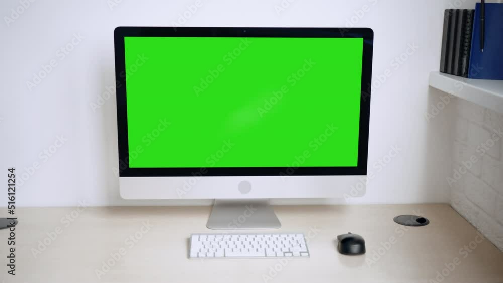 Poster camera move forward to computer with green screen working place at home or office
