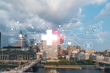 Aerial panorama city view of Philadelphia financial downtown at day time, Pennsylvania, USA. Hologram healthcare digital medicine icons. The concept of treatment from disease, Threat of pandemic