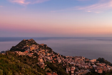 Panoramic view during sunset on coastline of Ionian Mediterranean sea, Taormina, Sicily, Italy,...