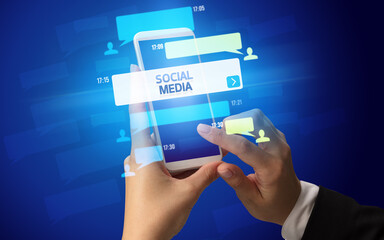 Hand using smartphone with social media concept