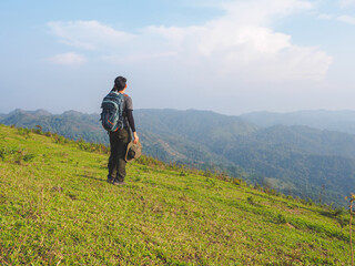 Fototapeta na wymiar Trekking solo backpack on mountain trail in tropical forest at Tak Province, Thailand.