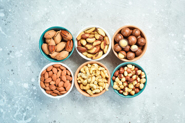 Assortment of nuts: almonds, hazelnuts, cashews and macadamia nuts and pecans. Walnut background....