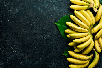 Yellow tropical sweet little baby bananas. Free copy space. Top view.