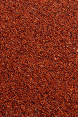 Healthy Organic Food. Black Quinoa Macro photo. On a gray stone background. Top view.