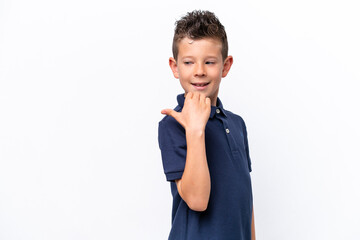 Little caucasian boy isolated on white background pointing to the side to present a product