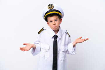 Little airplane pilot boy isolated on white background having doubts while raising hands