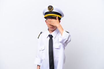 Little airplane pilot boy isolated on white background covering eyes by hands. Do not want to see something