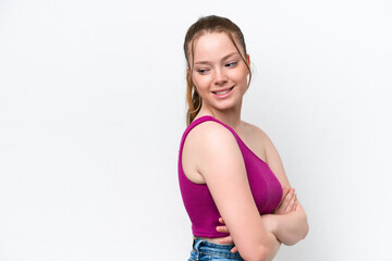 Young caucasian girl isolated on white background with arms crossed and happy