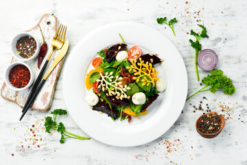 Salad with beets, spinach and vegetables. Cold snacks. Rustic style.