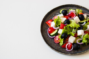 A dish with Greek salad. View from above.