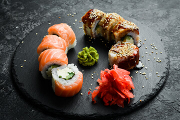 Traditional sushi rolls on a stone plate. Close-up. Sushi menu. Japanese food.