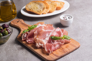 Closeup of thin slices of prosciutto. Italian food 