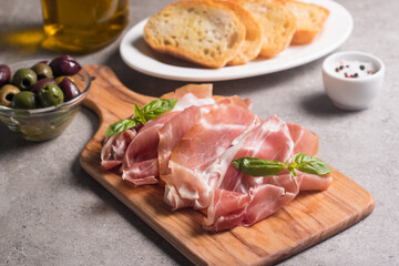 Closeup of thin slices of prosciutto. Italian food 