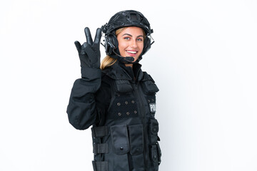 SWAT caucasian woman isolated on white background smiling and showing victory sign