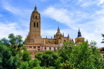 Fototapeta na wymiar View of the impressive cathedral of Segovia with its high tower rising into the sky, Spain.