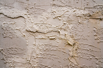 Cracks in textured exterior plaster