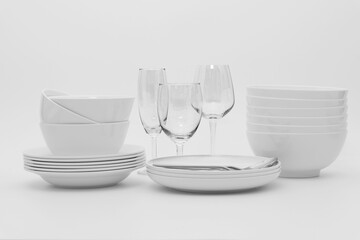 set clean dishes glasses on white