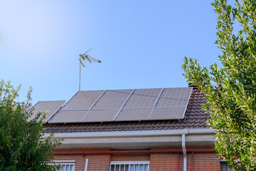 Solar panels on the roof of a house. Concept of renewable energy