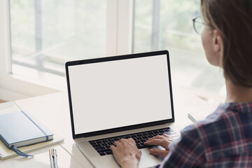 Young woman using laptop computer at home. Business woman working in office. Freelance, student lifestyle, e-learning, studying, web site, technology and online shopping concept